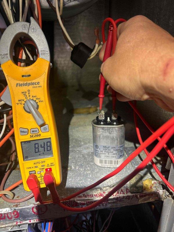 Completed annual Gold Level preventative maintenance on single-system HVAC unit. Performed comprehensive electrical diagnostics including capacitor testing with digital multimeter, verifying proper microfarad readings and voltage levels at 182V. Measured amperage draw at 8.48 amps using clamp meter to confirm system operating within manufacturer specifications. All electrical components tested and found functioning properly with no deficiencies noted.