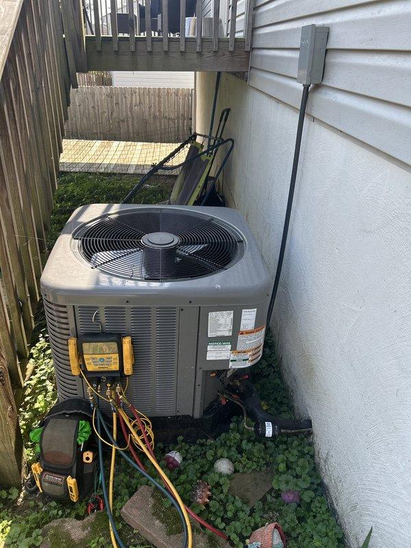 Performed routine maintenance tune-up on one-year-old heat pump system as courtesy follow-up to recent installation. Completed comprehensive inspection of outdoor condensing unit and indoor air handler located in utility closet, utilizing diagnostic gauges to verify refrigerant pressures and system performance. All components operating within manufacturer specifications with no deficiencies noted.