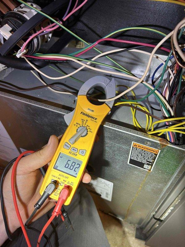 Completed Gold Level annual preventive maintenance on single-system HVAC unit located in basement. Performed electrical diagnostics on air handler, measuring current draw at 68.2 amps using clamp meter to verify proper compressor and blower motor operation. Verified wall-mounted thermostat functionality and system response. Customer providing their own filters as requested.