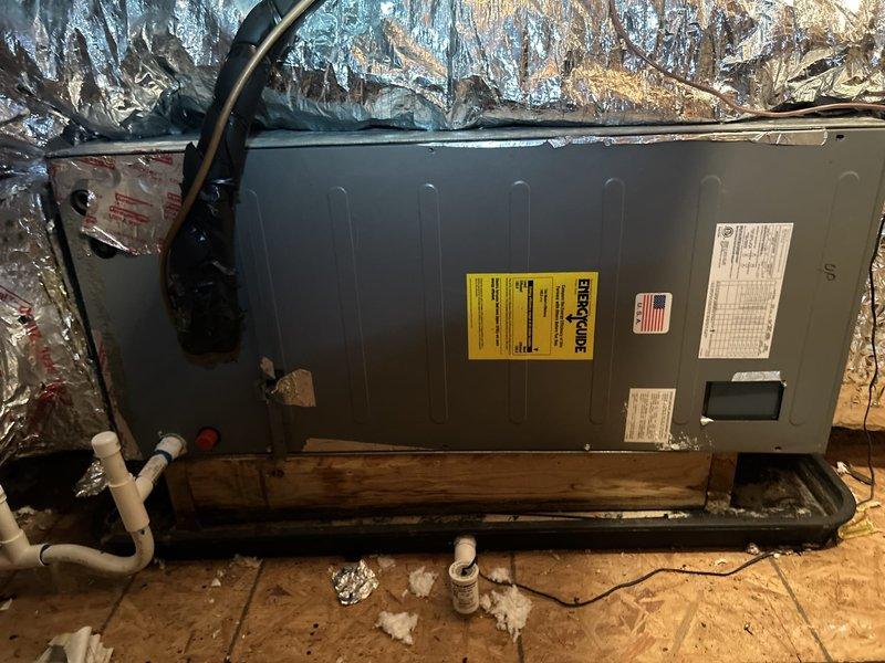 Completed USA Gold Duo Annual preventive maintenance on dual-zone HVAC system consisting of two heat pump and air handler combinations installed in attic space. Performed comprehensive inspection and maintenance procedures on both units including filter evaluation, electrical connection verification, condensate drain line inspection, and system operational testing. All equipment found operating within manufacturer specifications with no deficiencies noted. Both air handlers properly secured on wooden platforms with adequate clearance for service access. Documented system conditions with photographic records showing unit installations, ductwork configurations, and proper labeling of equipment.