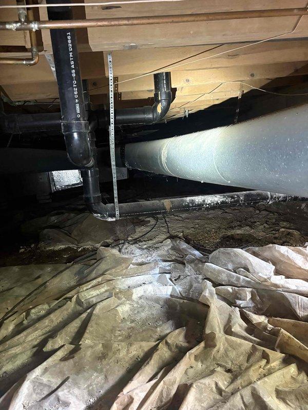 Responded to no cooling call on aging gas furnace/AC system with indoor unit located in crawlspace. Upon arrival, confirmed system was blowing warm air instead of conditioned air. Accessed crawlspace unit through confined entry point and performed diagnostic evaluation of both indoor air handler and outdoor condensing unit. Inspected ductwork, refrigerant lines, electrical connections, and thermostat communication. Documented existing conditions of crawlspace installation including insulation displacement and overall system accessibility challenges typical of older installations in confined spaces.