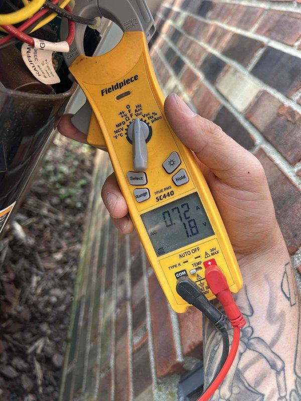 Completed fall preventive maintenance on 12-year-old heat pump and air handler system. Performed comprehensive tune-up including electrical testing with clamp meter to verify amperage draws, cleaned and inspected outdoor heat pump unit, serviced air handler located in crawlspace, and replaced customer-supplied 21.5x23.25x1 Greenpac filter. All components operating within normal parameters with no issues identified during inspection.