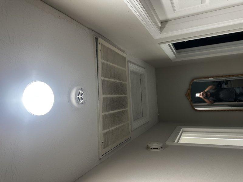 Completed site evaluation for Feel the Love program qualification to assess existing HVAC system and ductwork infrastructure. Inspected interior spaces including bathroom area with return air ventilation and documented equipment specifications through detailed measurements and photography. Confirmed presence of existing ductwork system and verified equipment nameplate information to determine system compatibility and eligibility for program participation.