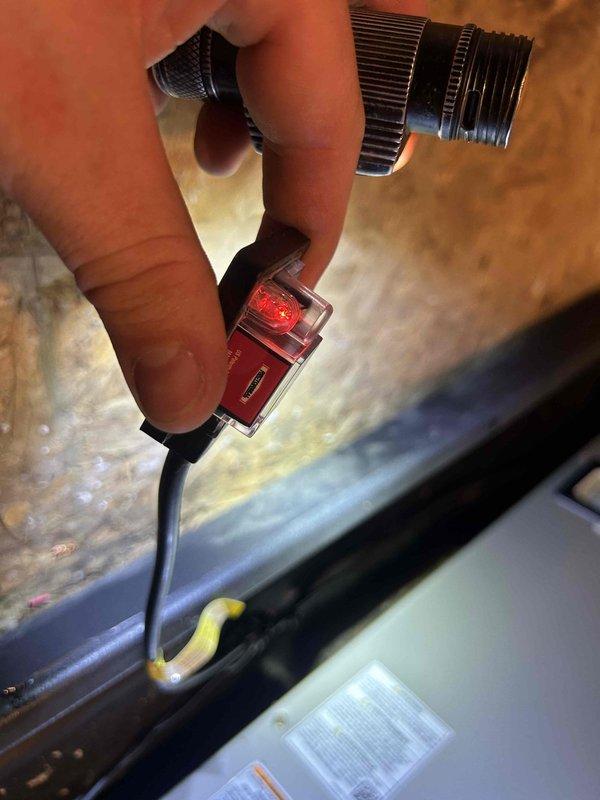 Responded to no cooling call for 3-year-old heat pump system. Upon arrival, confirmed thermostat had no power and display was blank. Performed diagnostic testing on HVAC system components in attic location. Traced low voltage wiring from air handler to thermostat, checking transformer output voltage and circuit continuity. Identified power supply issue preventing thermostat operation. Completed necessary repairs to restore 24V power to thermostat circuit. Verified air handler and heat pump operation, confirmed system cooling properly and thermostat functioning normally. All equipment covered under existing parts and labor warranty. System returned to normal operation with cooling restored.