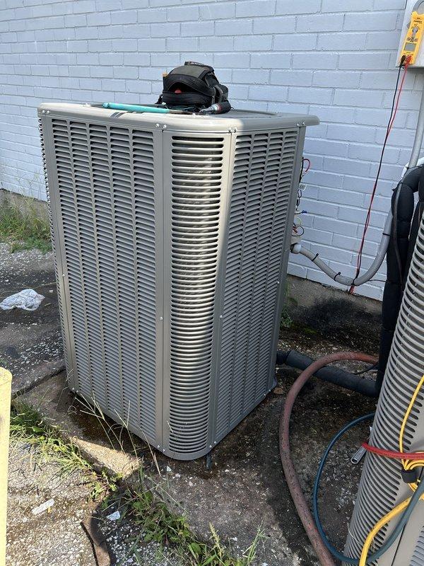 Replaced damaged outdoor electrical disconnect serving commercial HVAC condenser unit with new 60-amp Square D QO series disconnect switch. Removed old weathered disconnect panel, installed new enclosure on exterior concrete block wall, and reconnected all power conductors and grounding wires to proper terminals within the new disconnect box.