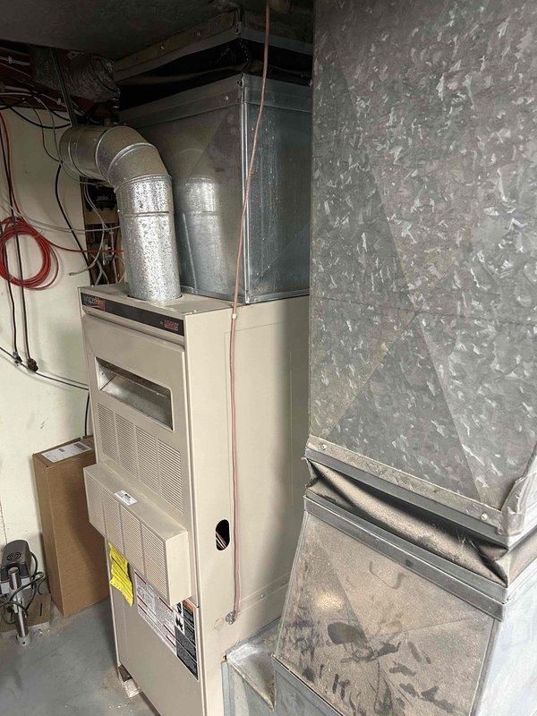Installed a fan-powered humidifier on the existing forced-air furnace system. Connected the unit to the main supply ductwork, established proper drainage to the condensate pan, and wired the humidistat for automatic operation. Customer will remit payment by check.