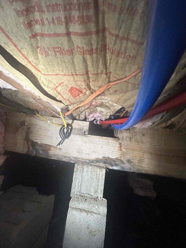 Relocated and raised galvanized water supply lines to accommodate structural support beam replacement in basement crawl space. Rerouted existing water distribution piping using PEX connections to provide adequate clearance above the new support beam location while maintaining proper pitch and support. All water lines were secured to floor joists with appropriate hangers and tested for proper flow and pressure upon completion.