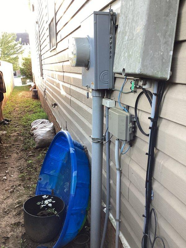 Conducted site assessment for hardwired outdoor Level 2 EV charging station installation. Evaluated existing electrical service panel capacity, verified available breaker spaces, and assessed exterior mounting location approximately 15 feet from main electrical panel. Documented current electrical infrastructure including meter base, existing conduit runs, and panel configuration to determine installation requirements and project timeline for the proposed EV charger installation.