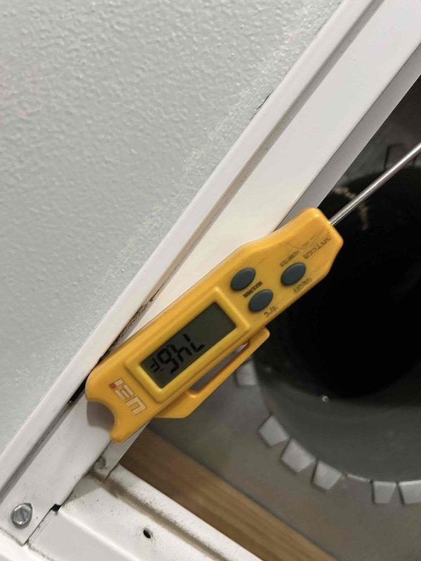 Responded to service call for 33-year-old AC unit not maintaining adequate cooling performance during hot weather. Upon arrival, performed diagnostic assessment of attic-mounted air conditioning system. Conducted temperature measurements at supply registers using calibrated digital thermometer to verify cooling output deficiency. Inspected aging equipment in attic space, including air handler and associated ductwork. Documented current condition of system components showing significant age-related wear and accumulated dust/debris on cabinet surfaces. Photographed equipment configuration and measurement readings for service records. Advised customer that unit has exceeded typical service life expectancy and discussed performance limitations of aging system during peak cooling demand periods.
