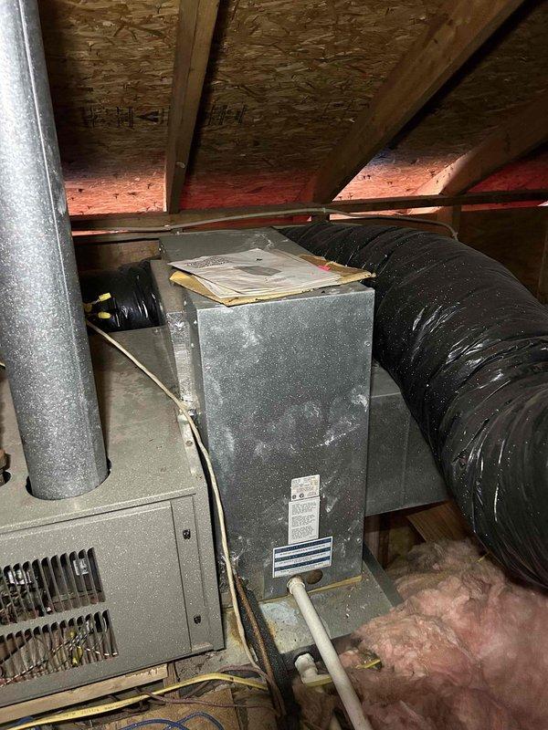 Responded to service call for 33-year-old AC unit not maintaining adequate cooling performance during hot weather. Upon arrival, performed diagnostic assessment of attic-mounted air conditioning system. Conducted temperature measurements at supply registers using calibrated digital thermometer to verify cooling output deficiency. Inspected aging equipment in attic space, including air handler and associated ductwork. Documented current condition of system components showing significant age-related wear and accumulated dust/debris on cabinet surfaces. Photographed equipment configuration and measurement readings for service records. Advised customer that unit has exceeded typical service life expectancy and discussed performance limitations of aging system during peak cooling demand periods.