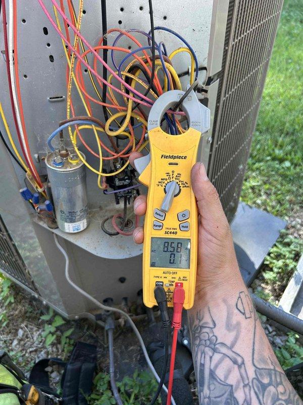 Performed comprehensive HVAC maintenance on dual heat pump system with air handlers located in attic and garage. Conducted electrical diagnostics using clamp meter to verify proper amperage draw and voltage levels at outdoor unit electrical panel, inspected capacitor and control wiring connections. Replaced air filters including 14x20x1 and 14x14x1 sizes, completed standard tune-up procedures on both systems to ensure optimal performance and efficiency.
