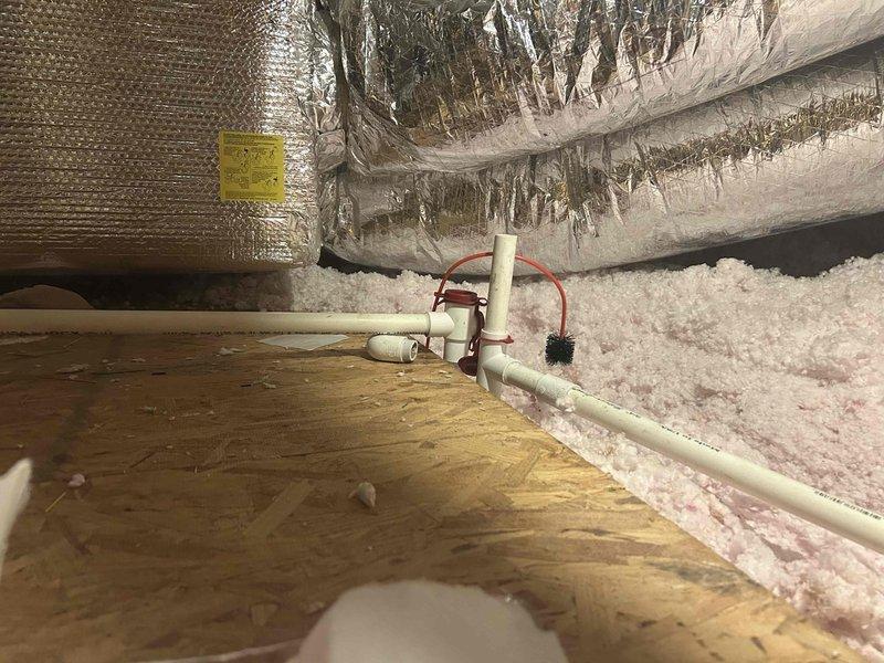 Responded to no cooling call where unit made strange noise before shutting down completely with blank thermostat. Upon arrival, located air handler in bathroom area and accessed attic-mounted equipment. Performed diagnostic inspection of electrical system and discovered complete system failure due to age and deterioration of components. Documented existing conditions including degraded insulation, exposed wiring concerns, and overall equipment deterioration consistent with system age exceeding ten years. Advised customer of findings and provided recommendations for system replacement due to extensive wear and safety concerns with current installation.