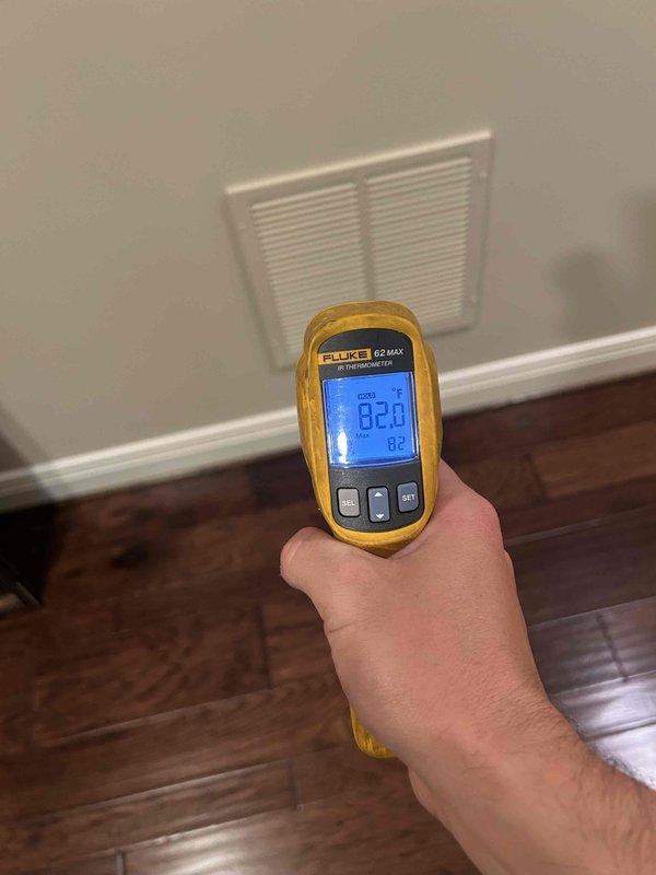 Responded to service call for non-cooling complaint and performed leak search on HVAC system. Upon inspection, found unit completely void of refrigerant, indicating a significant leak in the system. Documented thermostat displaying 92°F ambient temperature with setpoint at 68°F, confirming lack of cooling capacity, and recorded supply air temperature readings to verify no refrigerant in system.