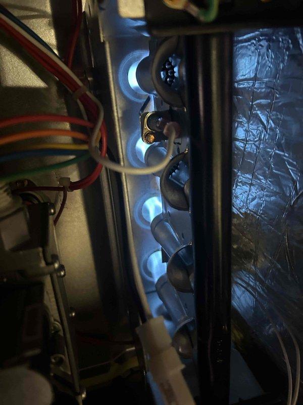 Completed preventative maintenance on gas furnace and air conditioning system located in basement. Inspected and verified proper operation of burners with blue flame combustion pattern. Observed significant condensation buildup on air handling unit exterior, indicating potential insulation or airflow concerns. Evaluated humidifier system and confirmed need to assess steam humidifier canister condition for potential replacement. Installed customer-supplied 16x20x4 air filter. System operational at time of departure.