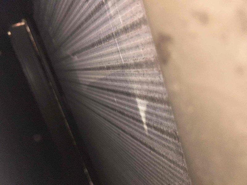 Completed routine HVAC maintenance inspection in basement mechanical space. Performed system diagnostics including pressure testing with gauge readings indicating approximately 40 PSI, inspected flexible ductwork for proper installation and condition, and serviced washable filter. All components found operating within normal parameters with no immediate repairs required.