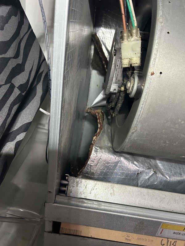 Responded to no cooling complaint on 6-year-old electric commercial HVAC unit blowing warm air. Upon inspection, found indoor unit in utility closet with heavy accumulation of dirt, dust, and debris throughout the compartment and on internal components. Measured supply air temperature at 56.6°F, confirming inadequate cooling. Identified severely soiled evaporator coil and restricted airflow as primary cause of cooling failure. Cleaned evaporator coil, removed debris from blower compartment, and verified proper airflow restoration. System returned to normal cooling operation with appropriate temperature differential.