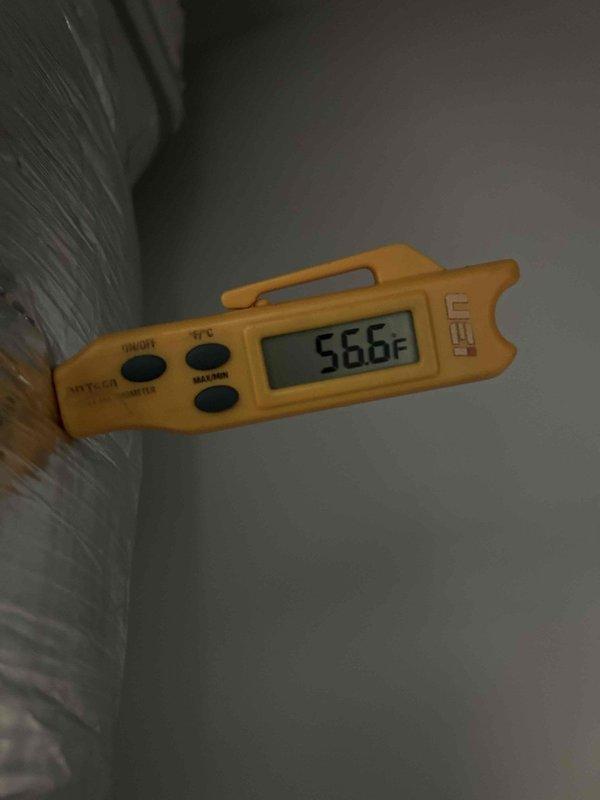 Responded to no cooling complaint on 6-year-old electric commercial HVAC unit blowing warm air. Upon inspection, found indoor unit in utility closet with heavy accumulation of dirt, dust, and debris throughout the compartment and on internal components. Measured supply air temperature at 56.6°F, confirming inadequate cooling. Identified severely soiled evaporator coil and restricted airflow as primary cause of cooling failure. Cleaned evaporator coil, removed debris from blower compartment, and verified proper airflow restoration. System returned to normal cooling operation with appropriate temperature differential.