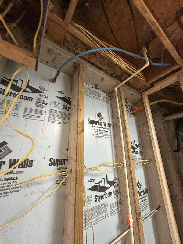 Completed electrical estimate for pool installation in unfinished basement space. Assessment included review of existing electrical panel capacity, evaluation of required circuit routing through exposed stud walls with foam insulation, and determination of wiring pathways from main service panel to future pool equipment location.