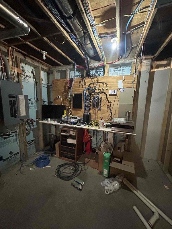 Completed electrical estimate for pool installation in unfinished basement space. Assessment included review of existing electrical panel capacity, evaluation of required circuit routing through exposed stud walls with foam insulation, and determination of wiring pathways from main service panel to future pool equipment location.