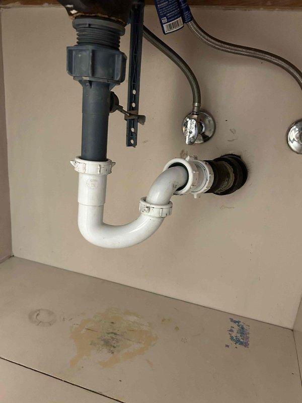Responded to service call for non-draining upstairs bathroom sink. Upon inspection, assessed the white ceramic basin with chrome faucet assembly and identified drainage obstruction. Performed drain clearing procedures to restore proper water flow through the P-trap and drain line, successfully resolving the clog and returning the fixture to normal operation.