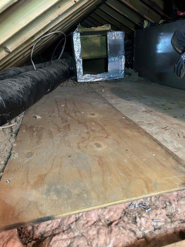 Coordinated with water damage restoration company to address moisture-damaged plywood subflooring beneath attic-mounted air handler unit. Disconnected and temporarily removed air handler from platform, removed compromised plywood decking, installed new plywood substrate, and reinstalled air handler to manufacturer specifications. Verified all ductwork connections, condensate lines, and electrical connections upon completion of reinstallation.