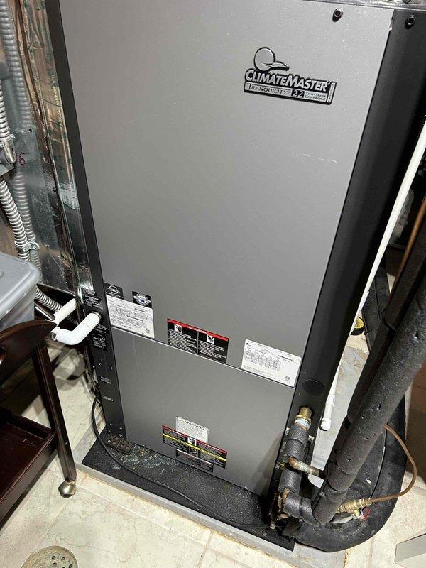 Responded to no airflow complaint on downstairs ClimateMaster Tranquility 22 geothermal heat pump system showing 10-degree temperature differential with thermostat calling for second stage cooling. Upon inspection, found electrical contactor issue related to recent Symphony monitoring device installation. Verified proper wiring connections to contactor terminals, corrected compromised connections, and restored system operation with normal airflow and cooling capacity.