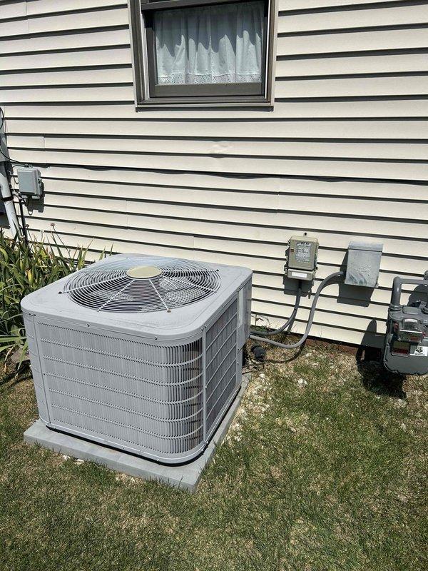 Responded to no-cool complaint on 7-year-old electric air conditioning system where indoor temperature had reached 82 degrees with minimal airflow. Evaluated outdoor condensing unit positioned on concrete pad with proper electrical disconnect and meter connections. Assessed indoor air handler system located in crawlspace with accessible PVC drainage lines and vapor barrier installation. Provided comprehensive replacement estimate for complete HVAC system due to cooling failure and inadequate air circulation performance.