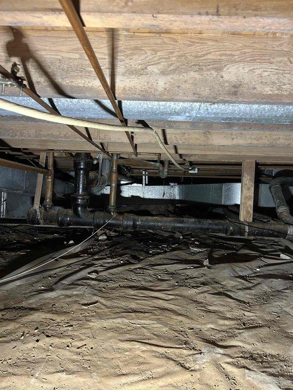 Accessed crawl space and successfully tapped into existing cold water supply line. Installed new copper water line running from connection point in crawl space through floor structure to kitchen area. Routed supply line to refrigerator location and connected to ice maker box behind appliance. Installed shut-off valve for dedicated ice maker supply line. Tested all connections for leaks and verified proper water flow to ice maker. All plumbing work completed to code with secure mounting and proper support throughout the run.