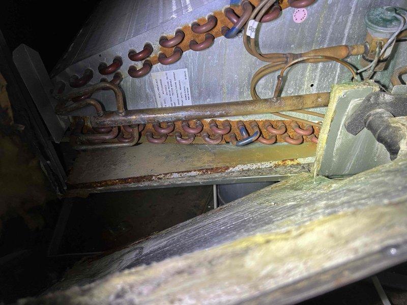 Responded to no-cooling complaint on 9-year-old air conditioning system with thermostat reading 83°F despite unit running. Upon inspection, found evaporator coil heavily soiled with accumulated dirt, dust, and debris restricting airflow and severely limiting heat transfer capacity. Cleaned evaporator coil thoroughly, removed obstructions, and verified proper airflow restoration. Confirmed system cooling operation, adequate refrigerant charge, and proper fan operation. Unit now cooling effectively with improved temperature differential across coil.