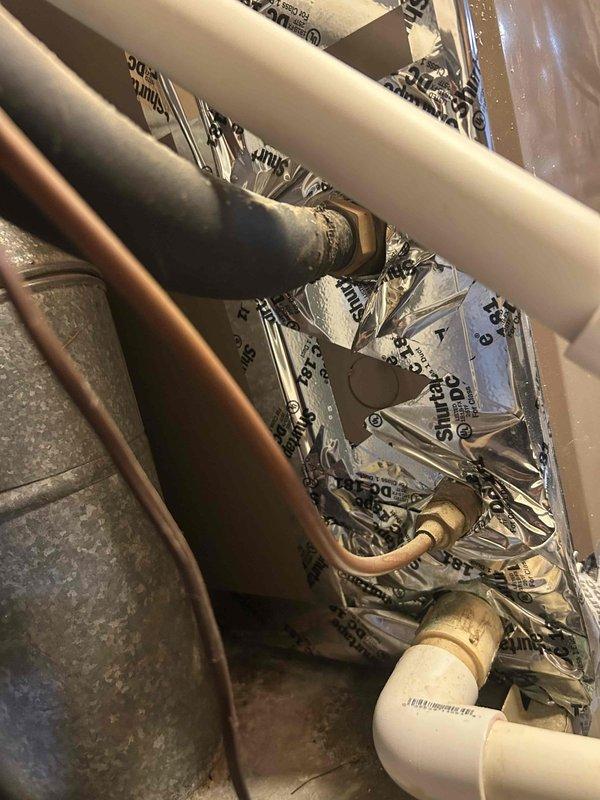 Responded to no cooling call on 44-year-old GE electric AC with gas furnace system located in basement. Upon arrival, confirmed outdoor condenser fan motor was not operating. Performed diagnostic testing on electrical components and contactor operation. Found failed capacitor preventing outdoor fan motor from starting, consistent with age-related component failure on this aging system. Replaced defective capacitor, restored power, and verified proper operation of condenser fan and compressor. System returned to normal cooling operation with all components functioning within manufacturer specifications.