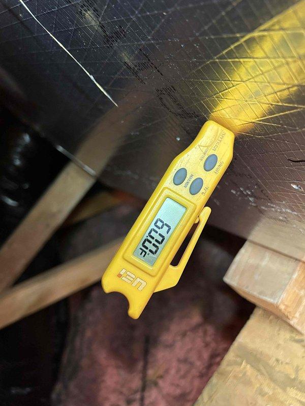 Responded to callback for system leaking and not cooling with indoor temperature at 78-79°F. Performed diagnostic temperature measurements throughout system and documented conditions in attic space, measuring supply air temperature at 30.25°F indicating compressor operation but inadequate cooling delivery to occupied space. Issue appears related to recurring refrigerant leak from previous service visit requiring further investigation and repair.