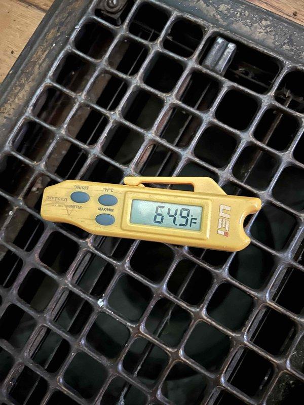 Responded to no cooling call on 5-year-old standard split system with gas furnace and basement air handler. Customer reported outdoor condenser unit not operating and system blowing warm air. Upon arrival, confirmed supply air temperature at register measured 84.9°F, indicating no cooling occurring. Inspected Trane condenser unit exterior, noting unit showed normal weathering for age with algae growth on panels but structurally sound. Diagnosed outdoor unit failure to energize, preventing refrigeration cycle from initiating and resulting in air handler circulating unconditioned air only.