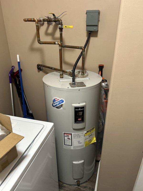 Conducted on-site evaluation of a 16-year-old Bradford White 50-gallon electric water heater (Model NFGRS50S36N-1/VN) located in a utility room adjacent to the garage. The unit features dual heating elements rated at 4500/3500 watts operating at 240V/208V, with standard copper piping connections, shutoff valves, and electrical conduit properly installed. Given the age of the water heater approaching the typical lifespan for residential electric tanks, provided comprehensive estimate for replacement options including both traditional tank and tankless configurations to meet current household hot water demands.