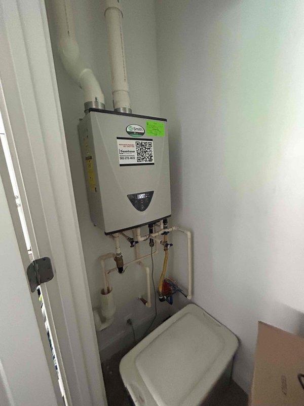Performed comprehensive maintenance and descaling flush on wall-mounted tankless water heater unit. Isolated water supply using shut-off valves, connected flushing equipment to service ports, and circulated descaling solution through the heat exchanger to remove mineral buildup and scale deposits. Inspected inlet filter screen for debris, verified proper operation of all connections and valves, and tested unit functionality upon completion. Confirmed adequate venting through PVC exhaust pipes and checked digital display for error codes. System restored to normal operation with improved efficiency and extended service life.