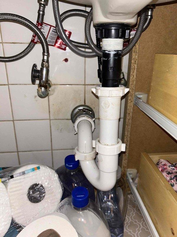 Completed comprehensive plumbing inspection including plumbing service agreement evaluation and diagnostics for reported running toilet. Inspected bathroom plumbing fixtures, tub and shower assembly with rail-mounted combination showerhead system, under-sink plumbing configuration with garbage disposal unit, braided stainless steel supply lines, PVC drainage system with P-trap assembly, and shut-off valves to ensure proper operation and identify any maintenance needs.