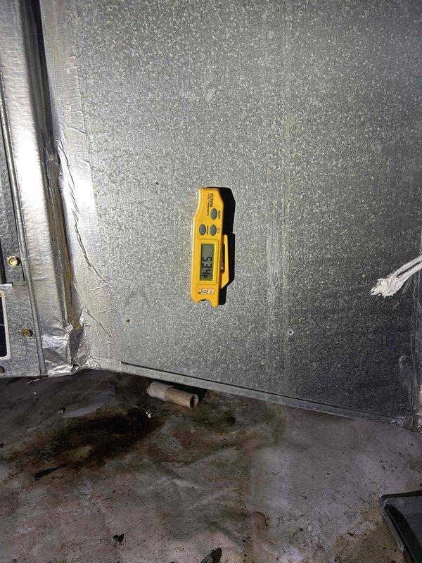 # HVAC Repair - No Cooling Issue on 16-Year-Old Carrier System

Responded to service call for lack of airflow through interior vents despite operational outdoor unit and system fan. Upon arrival, performed comprehensive diagnostic evaluation of 16-year-old Carrier HVAC system.

Inspection revealed significant airflow restriction within the air handler unit. Accessed interior components and discovered severely compromised blower assembly operation. Temperature readings taken at evaporator coil measured 53.8°F, indicating refrigerant circuit was functional but air distribution was impaired.

Detailed examination of ductwork and air handler cabinet exposed extensive dust and debris accumulation throughout the system, consistent with lack of regular maintenance over the unit's service life. Corroded mounting brackets and hardware showed advanced deterioration, indicating prolonged exposure to moisture and operational stress.

Critical finding: Identified substantial water damage and microb