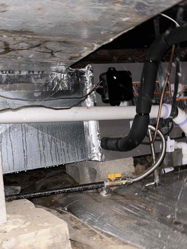 Responded to no cooling complaint on recently installed system. Found extensive ice buildup on evaporator coil and air handler components indicating severely restricted airflow. Discovered airflow obstruction causing coil to freeze completely with ice formations throughout indoor unit and ductwork. Shut down system to allow ice to thaw, identified and corrected airflow restriction. Verified proper refrigerant charge on 454B system, checked static pressures, and confirmed adequate airflow across coil. System returned to normal operation with proper cooling performance and temperature split after correcting airflow issue that caused freezing condition.
