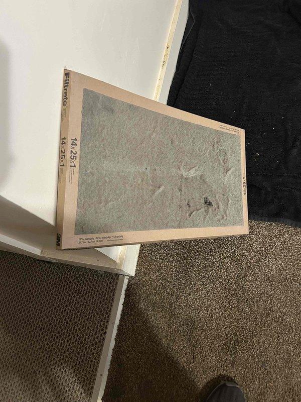 Responded to no cooling complaint on residential electric HVAC system with indoor unit located in crawlspace. Upon arrival, found extremely dirty and clogged air filters restricting airflow to the system. Replaced both filters with new 14x25x1 units to restore proper air circulation. Measured supply air temperature at 53.5°F at the evaporator coil, confirming system is now cooling adequately. System returned to normal operation with proper airflow and cooling capacity restored.