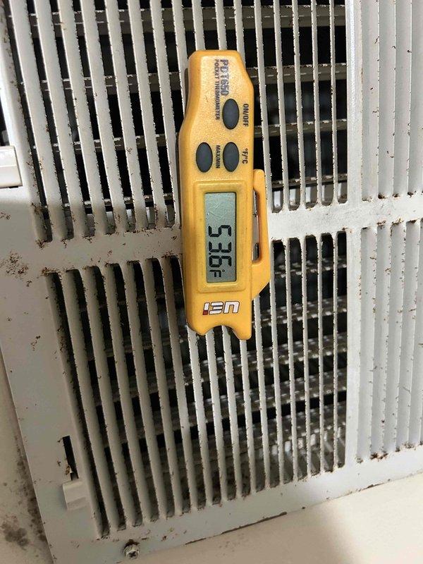 Responded to no cooling complaint on residential electric HVAC system with indoor unit located in crawlspace. Upon arrival, found extremely dirty and clogged air filters restricting airflow to the system. Replaced both filters with new 14x25x1 units to restore proper air circulation. Measured supply air temperature at 53.5°F at the evaporator coil, confirming system is now cooling adequately. System returned to normal operation with proper airflow and cooling capacity restored.