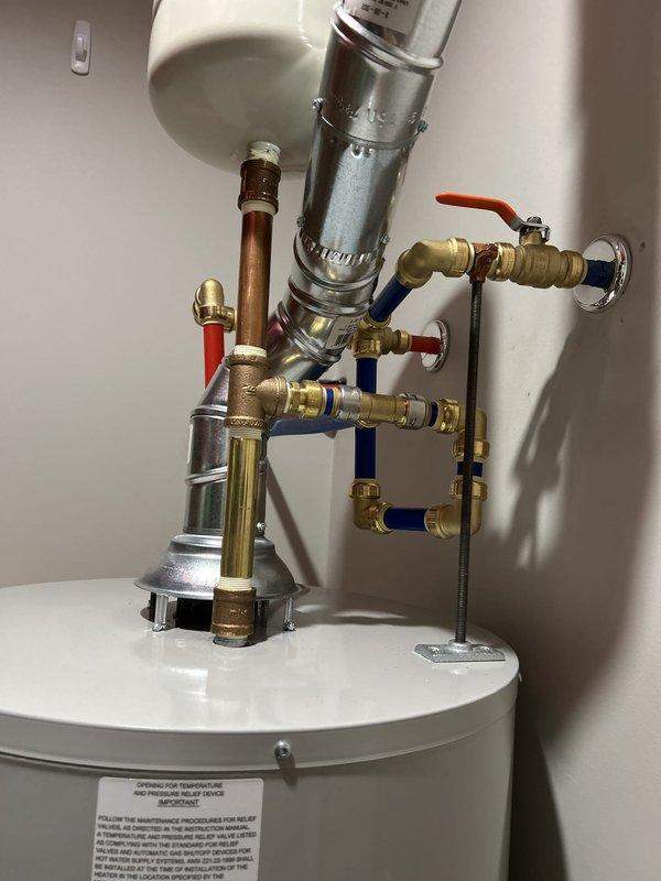 Completed comprehensive plumbing inspection of water heater system and associated components. Inspected water heater installation, expansion tank mounting, copper piping, PEX supply lines (hot and cold), brass shut-off valves, and flexible supply connections. All components were found to be properly installed with secure mounting brackets, professional-grade fittings, and appropriate pipe routing. System appears to be functioning as designed with no visible leaks or deficiencies noted at time of inspection.