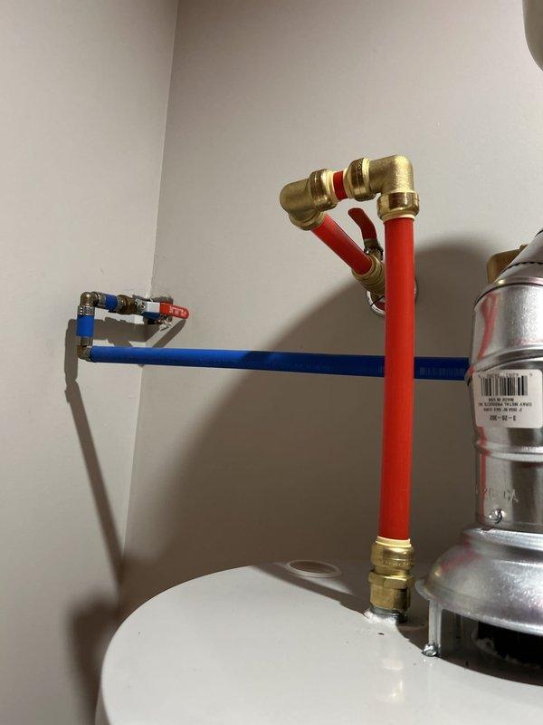 Completed comprehensive plumbing inspection of water heater system and associated components. Inspected water heater installation, expansion tank mounting, copper piping, PEX supply lines (hot and cold), brass shut-off valves, and flexible supply connections. All components were found to be properly installed with secure mounting brackets, professional-grade fittings, and appropriate pipe routing. System appears to be functioning as designed with no visible leaks or deficiencies noted at time of inspection.