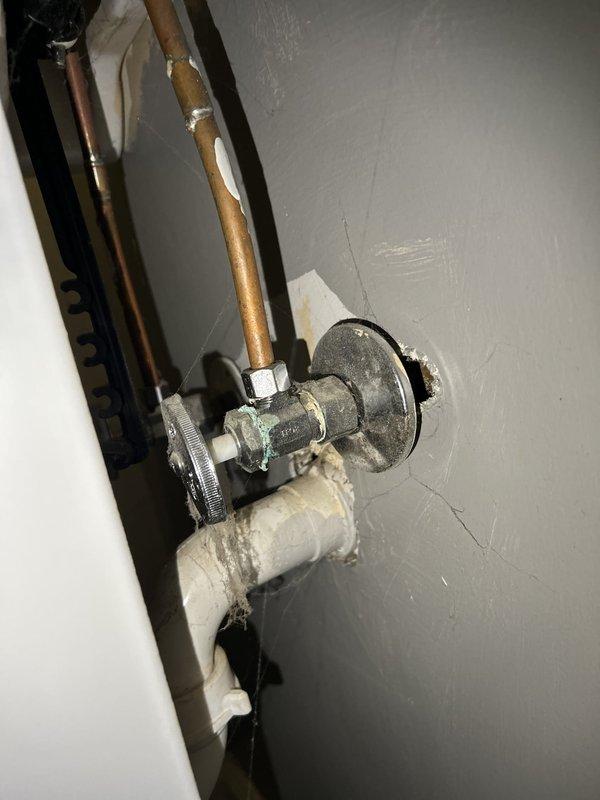 Completed comprehensive plumbing inspection of residential property in preparation for tenant move-in. Evaluated toilet tank assembly, noting significant mineral deposits and hard water staining on interior ceramic surfaces, functional flapper valve mechanism, and operational fill valve assembly with appropriate water levels. Inspected wall-mounted shutoff valve with copper supply line showing normal patina, and identified deteriorating pipe insulation requiring replacement. Documented all findings with photographic evidence and prepared detailed estimate for recommended plumbing repairs and maintenance items.