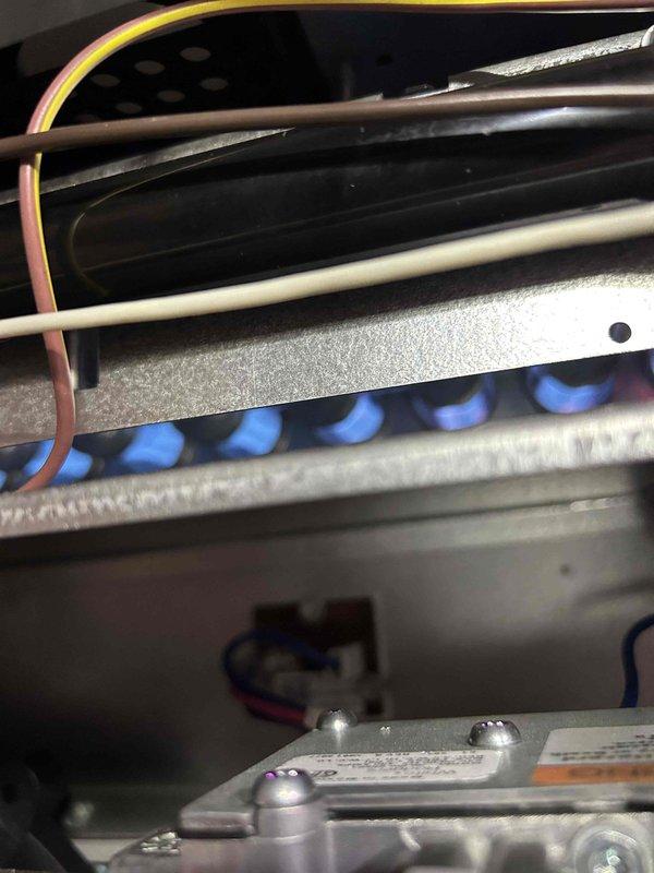 Completed Gold Level preventive maintenance on single-zone HVAC system including gas furnace and air conditioning unit. Performed comprehensive inspection with burner operation verified showing proper flame characteristics and combustion, temperature differential measurements recorded at 5.23 degrees, and photographic documentation captured of all critical components including heat exchanger, burner assembly, and gas valve system.