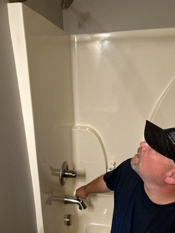 Responded to a plumbing emergency involving broken pipes affecting both exterior and interior plumbing systems. Assessed and repaired a burst pipe located near the building's exterior foundation where moisture infiltration had caused significant deterioration to surrounding concrete surfaces, evidenced by algae and organic growth. Proceeded to inspect and service interior bathroom plumbing fixtures, including bathtub valves and supply lines, to ensure proper function and prevent future leaks. All affected plumbing components were tested for proper water flow and pressure upon completion of repairs.
