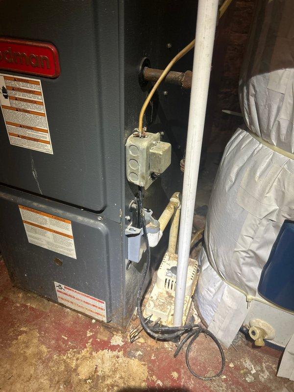 Performed second opinion evaluation on 18-year-old residential air conditioning system with no cooling condition. Confirmed previous diagnosis of evaporator coil leak in basement-mounted air handler unit. Assessed outdoor condenser unit showing significant age-related deterioration including weathered housing, damaged PVC line set covers with visible cracks and peeling material, and accumulated debris around unit. Provided comprehensive replacement estimate for complete HVAC system due to age of equipment exceeding typical service life and cost-effectiveness of replacement versus repair on failed refrigerant coil.