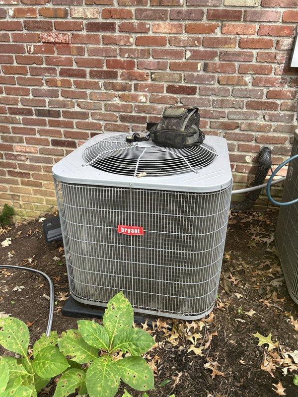 Responded to no cooling call on 5-year-old electric air conditioning system serving master bedroom and basement areas. Upon arrival, thermostat was set to 69°F but indoor temperature measured 74°F, with unit blowing lukewarm air instead of cold air. 

Performed diagnostic inspection of outdoor condensing unit and indoor air handler located in basement. Visual inspection of outdoor unit revealed severely corroded capacitor with significant oxidation and greenish patina on terminal connections. Capacitor showed dark discoloration at connection points with degraded wire terminals. Tested capacitor and confirmed failure, which prevented compressor from starting properly and resulted in loss of cooling capacity.

Replaced failed dual-run capacitor with new OEM-equivalent unit rated for proper microfarad and voltage specifications. Cleaned corroded terminal connections and secured all electrical connections to manufacturer specifications. Cycled system through complete cooling operation and 