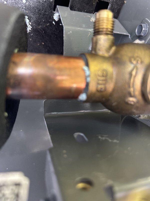 Responded to callback for system freezing issue previously addressed on 9/3. Upon inspection, discovered significant ice buildup on evaporator coil and surrounding components within air handler unit. Identified restricted airflow as primary cause due to clogged filter and reduced system capacity. Cleaned evaporator coil, replaced air filter, verified proper refrigerant charge and pressures, and confirmed drainage line functionality. System operating normally with adequate airflow and temperature differential at time of departure.