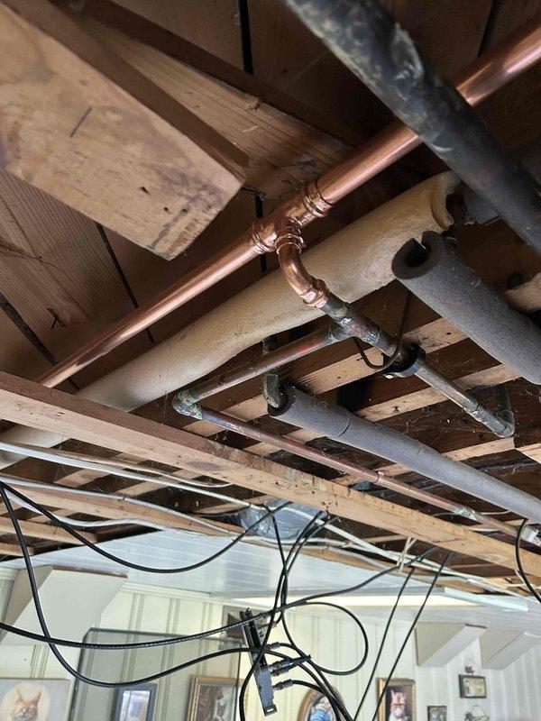 Completed comprehensive plumbing installation running new copper supply lines from the main water line connection to multiple fixtures including water heater, kitchen sink, and bathtub/shower assembly. Removed existing kitchen faucet and installed customer-supplied replacement unit, ensuring proper connections and seal integrity. All fixtures were tested for proper water flow, pressure, and functionality with no leaks detected prior to project completion.