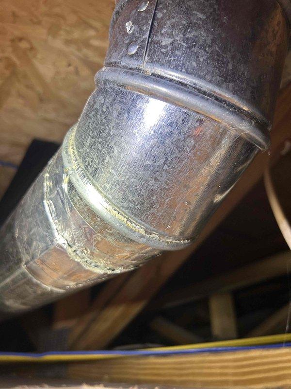 Responded to water leak complaint caused by damaged dryer exhaust line. Upon inspection, found flexible duct kinked and obstructed with accumulated pet hair and lint, creating condensation trap that leaked through ceiling below. Removed and replaced compromised exhaust ductwork, cleared all blockages from system, and verified proper airflow and drainage. Repaired water-damaged drywall in affected ceiling area and completed paint touch-up to restore surface finish.