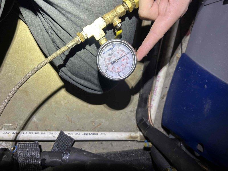 Completed annual Club Duo maintenance on a one-year-old geothermal system with indoor unit located in basement. Performed comprehensive system inspection and pressure testing in response to concerns about potential refrigerant leak from previous winter's low refrigerant condition. Inspected evaporator coil, which showed dirt and debris accumulation, and verified system pressures using calibrated gauges connected to service ports.